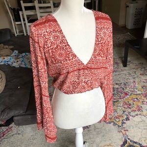 Deep plunge v floral bohemian flare sleeved top